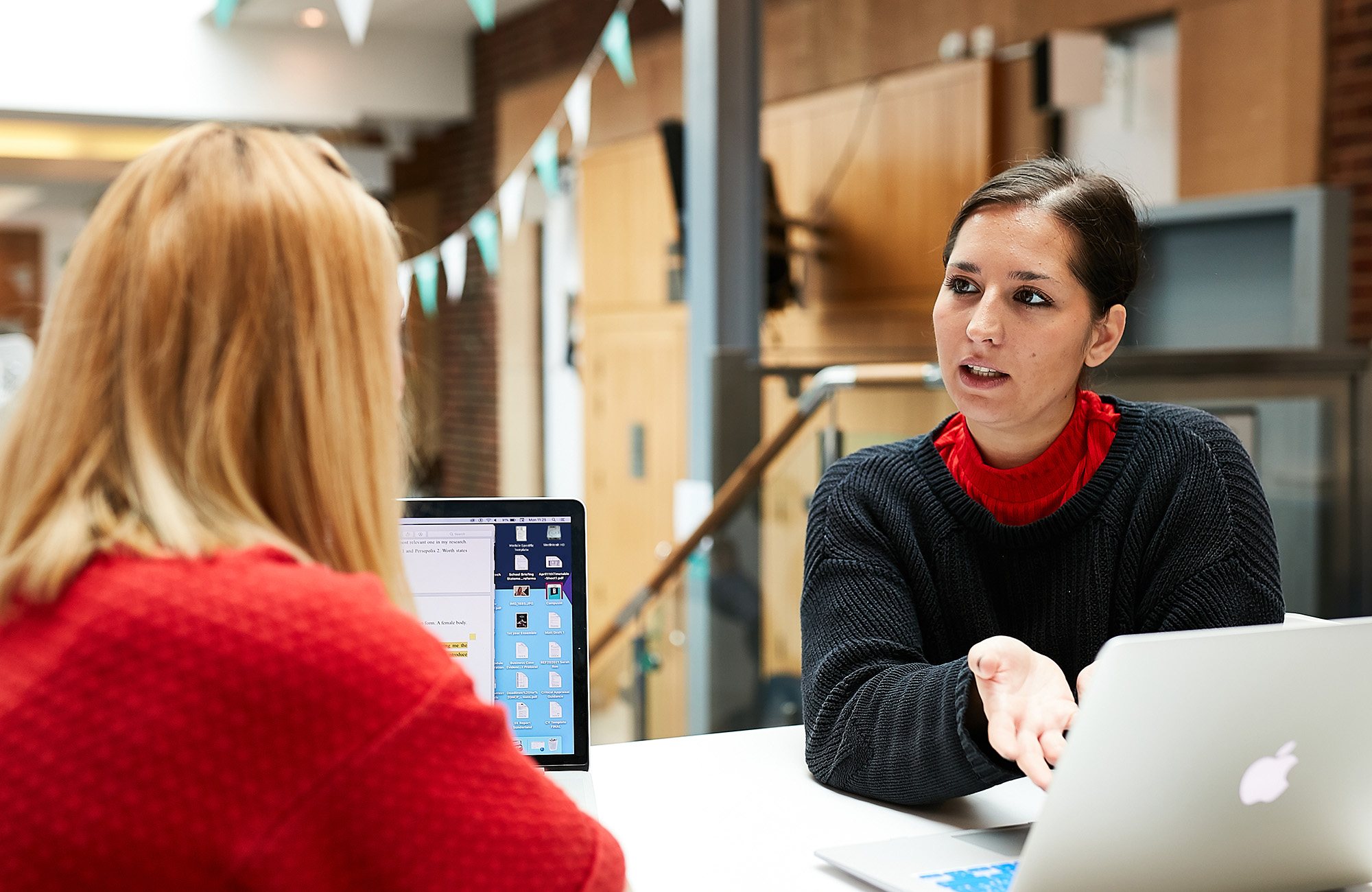2 people sat down discussing work